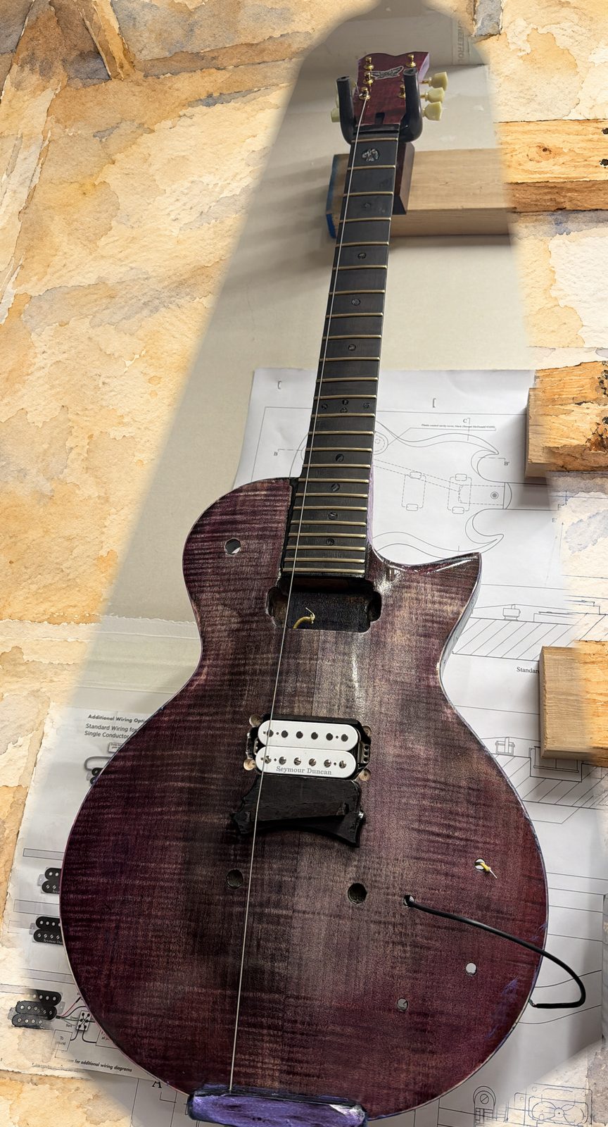 Lamia, workshop photo of a real guitar, painted ground.
